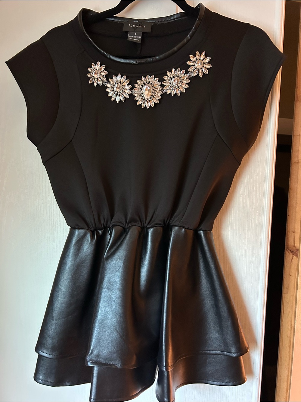 Gracia Black Top with Faux-Leather Peplum and Crystal Floral Necklace